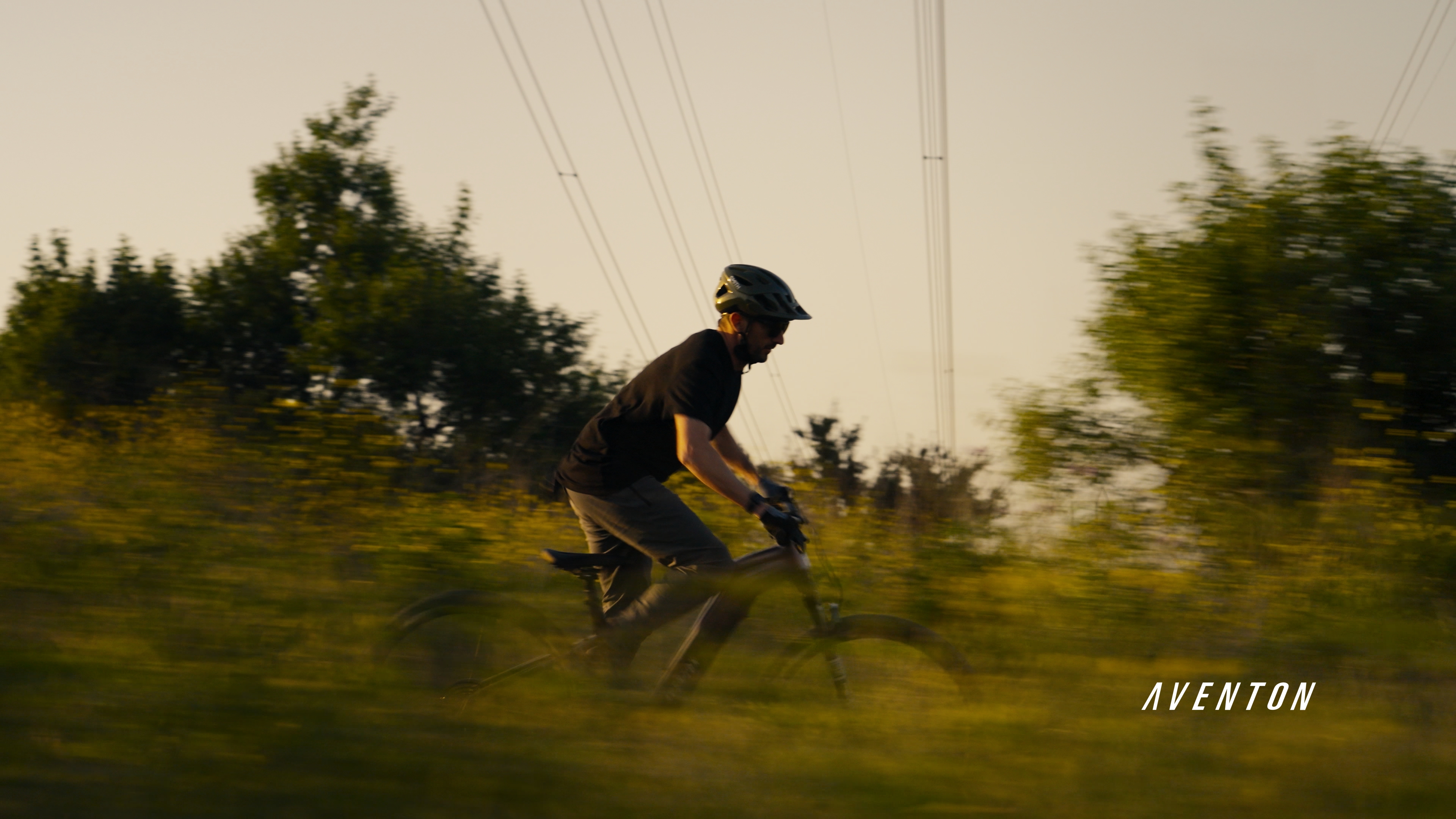 A rider crossing a rocky landscape in the Aventon EU teaser